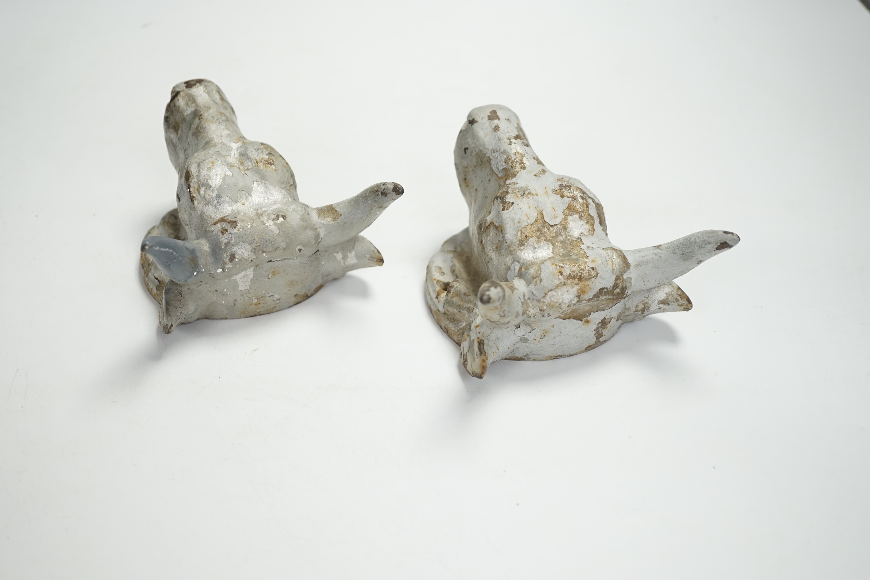 A pair of cast iron ‘bulls head’ mounts, 13.5cm